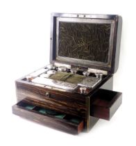 A Victorian Coromandel and brass inlaid dressing case, the hinged top with circular engraved cartouc