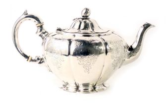 A Victorian silver teapot, with acorn finial, and engraved crosshatch and scroll pattern, with ivory