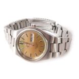 An Omega Seamaster Cosmic 2000 gent's wristwatch, with a gold coloured dial with batons, and day and