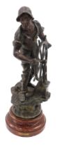 A 19thC French bronzed spelter figure of a sailor with ship's wheel, on a simulated marble base, 65c