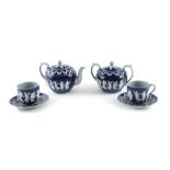 A Copeland ceramic part tea set, decorated in Wedgwood style with raised neoclassical figures in whi