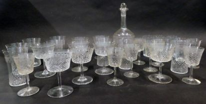 An early 20thC engraved part suite of glasses, to include decanter, tumblers, wine glasses, etc., so