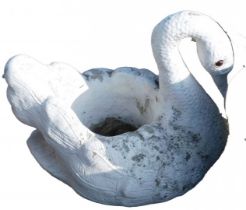 A reconstituted stone and painted swan garden planter, 51cm high.