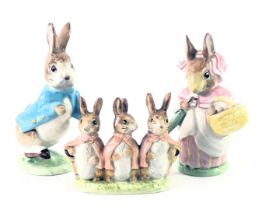 Three Beswick Beatrix potter figures, comprising Peter Rabbit, Flopsy, Mopsy, and Cotton Tail and Mr