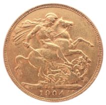 An Edward VII full gold sovereign dated 1904.