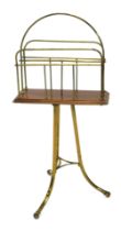 An Edwardian mahogany and brass revolving magazine rack or Canterbury, on tubular triform base, 36cm