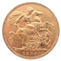 An Edward VII full gold sovereign dated 1904.