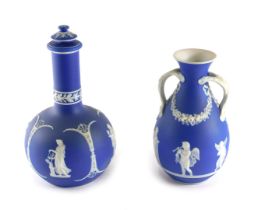 A Wedgwood style blue Jasperware bottle and cover, decorated with maidens, etc., 27cm high, and a si