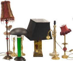 An Oriental lacquer style table lamp, decorated with figures and flowers on a black ground, and vari