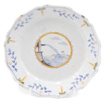 An 18thC French Faience plate, decorated with swimming figures, within flower and leaf borders, poss