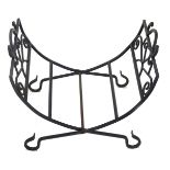 A wrought iron folding log stand, with side handles, 50cm wide.