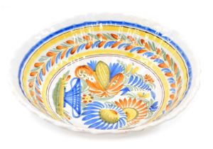 A 19thC Faience fruit bowl, decorated with a basket of flowers, leaf and flower bands, etc., unmarke