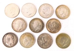 A collection of George V and George VI part silver half crowns.