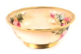 A Royal Worcester bowl, with gilt fluted border, painted rose decoration bearing signature Sedgley,
