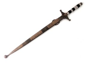 A Continental brass dagger, with an engraved scabbard and part horn handle, 53cm long.