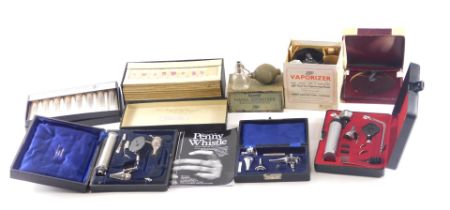 A quantity of medical instruments, to include a reflector scope, microscope slides, etc.