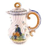 An early 20thC HR Quimper Faience teapot, decorated with seated figure and lady, within floral borde