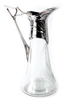 A WMF Art Nouveau claret jug, with a moulded and shaped handle, with a flower stem, and etched glass