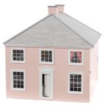 A pink and cream painted Georgian style dolls house, in three parts, 64cm wide.