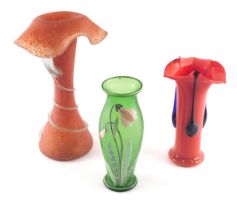 A collection of art glass, to include a red mottled glass vase, with fold over rim and decorated wit