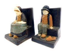 A pair of Berthe Savigny for Grand Maison HB Faience bookends, depicting male and female figures sea