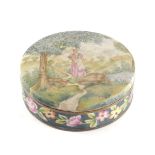 A German porcelain box and cover, with textured finish, painted with a lady within a landscape, the