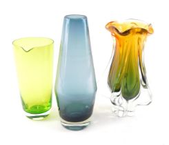 An art glass bullet shaped vase, in blue, a green jug, and a Murano style three coloured vase. (3)