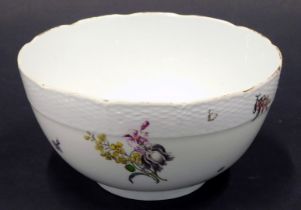 A Meissen porcelain bowl, decorated overall with flower sprays, within a stylised basket weave borde