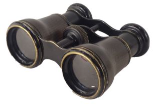 A pair of field glasses, each with a moulded and hatched rim, unmarked.