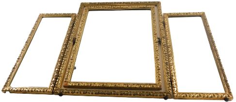 A gilt triple dressing table mirror, with moulded borders and bevelled plate, 47cm high, 46cm wide,