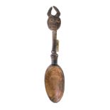 An African tribal Baule Goli Prestige spoon, carved with a devil style figure to the finial, shaped