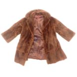 A ladies fur jacket, possibly Mink.