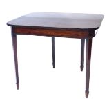 An early 19thC mahogany fold over tea table, the rectangular top with rounded front corners and a re