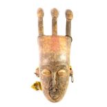 An African tribal Koulango Bana ancestors tribal mask, with three separate masks to the head, iron r
