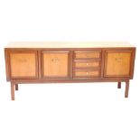 A 1970s/80s teak sideboard, with an arrangement of three drawers and three panelled doors.