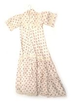 An early 1970s size 10 Laura Ashley vintage dress, decorated with brown flowers on a white ground wi
