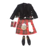 A gentleman's Scottish black dress jacket, kilt and accessories, to include a sporran with chrome pl