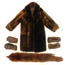 A brown three quarter length fur coat, scarf, and two pairs of gloves.