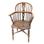 A 19thC yew, ash and elm Windsor chair, with a pierced splat, solid seat, on turned legs with X stre