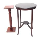 An Edwardian mahogany two tier table, on splayed legs, and a stained beech plant stand on brass feet