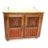 A oak cased jukebox, the hinged lid inset to the interior with a Flemish style machine woven tapestr