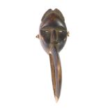 An African tribal Dan Maou Meditation mask, with stylised beak, Cote D'Ivoire circa 1980, 52cm long.