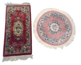 A Chinese red ground cut wool rug, with floral decoration and a circular pink ground Chinese rug, 18