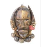 An African Tribal Dan Kran warrior's mask, with fabric border applied with shells and bells, Cote D'
