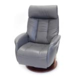 A Sitbest grey leather electric revolving adjustable armchair, with power supply.