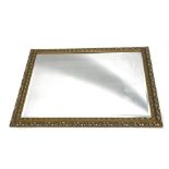 A gilt gesso rectangular wall mirror, with bevel plate, 90cm x 115cm.