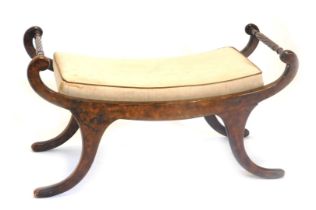 A stained beech window seat, the shaped arms with rope twist supports on sabre legs, 99cm wide.