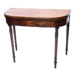 An early 19thC mahogany D shaped card table, the boxwood strung top with a cross banded border, abov