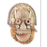 An African tribal Guere Chief's mask, embellished with horns, hare, Cote D'Ivoire circa 1950, 48cm h