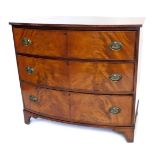 A 19thC bow fronted chest of drawers, the top with a reeded edge, above three drawers with oval bras